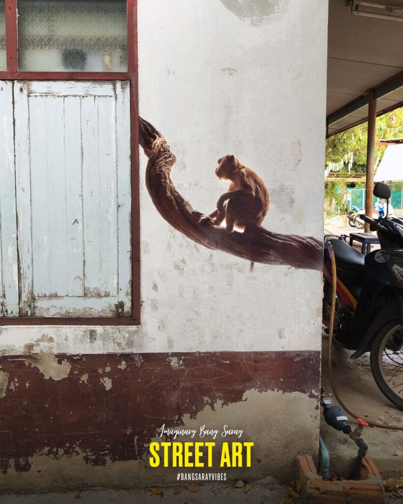 Street art of a monkey perched on a branch in Bang Saray, a coastal town in Thailand's Chonburi province.